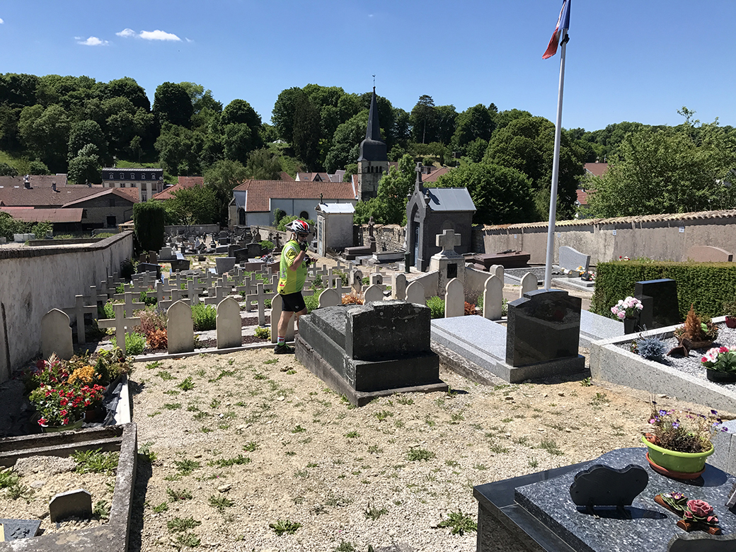 Steve walks in the village cemetery in Contrexéville - the military section is at his left